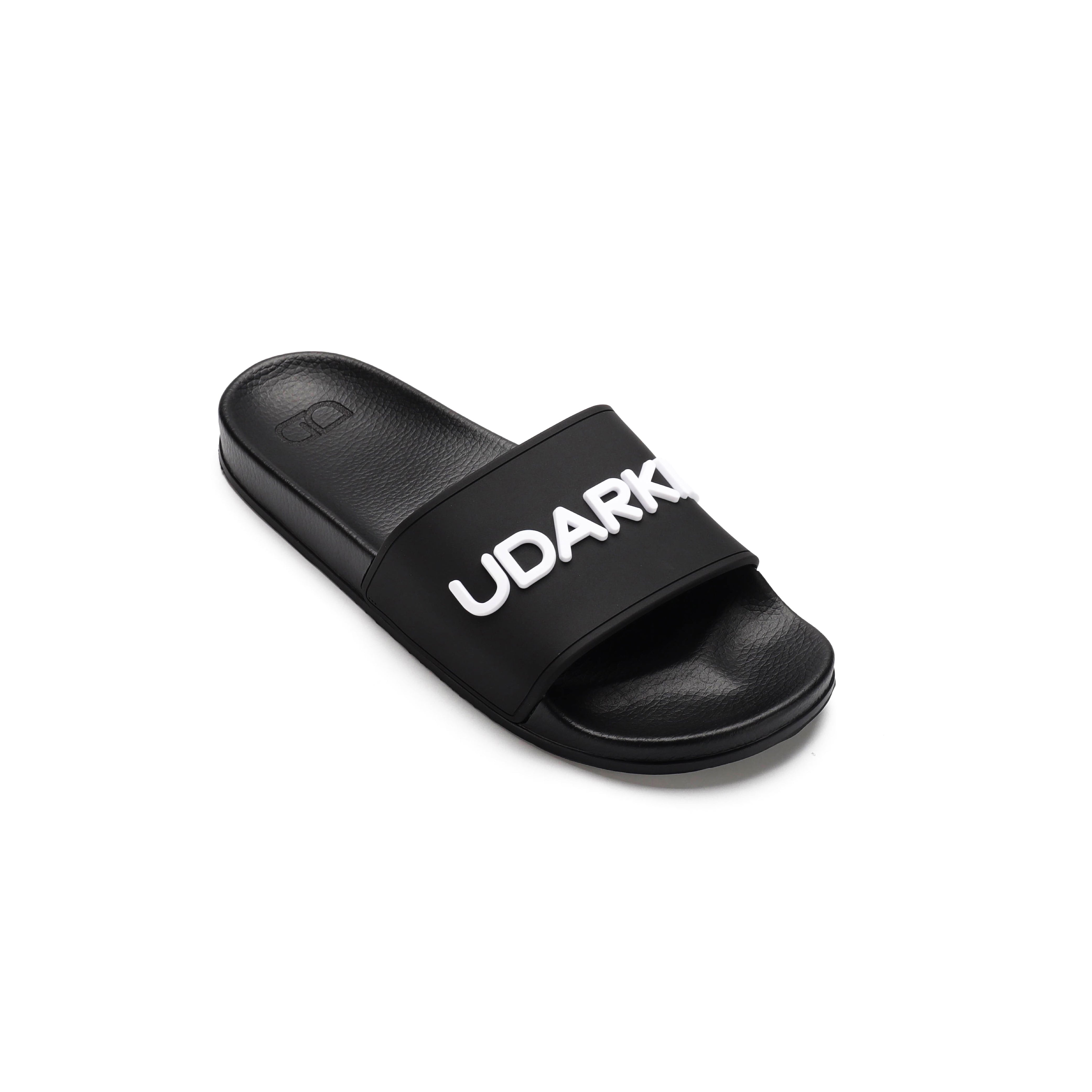 Pair of black slide sandal with white "UDARKIE" text across the strap. Features a simple design with textured footbed and synthetic material.