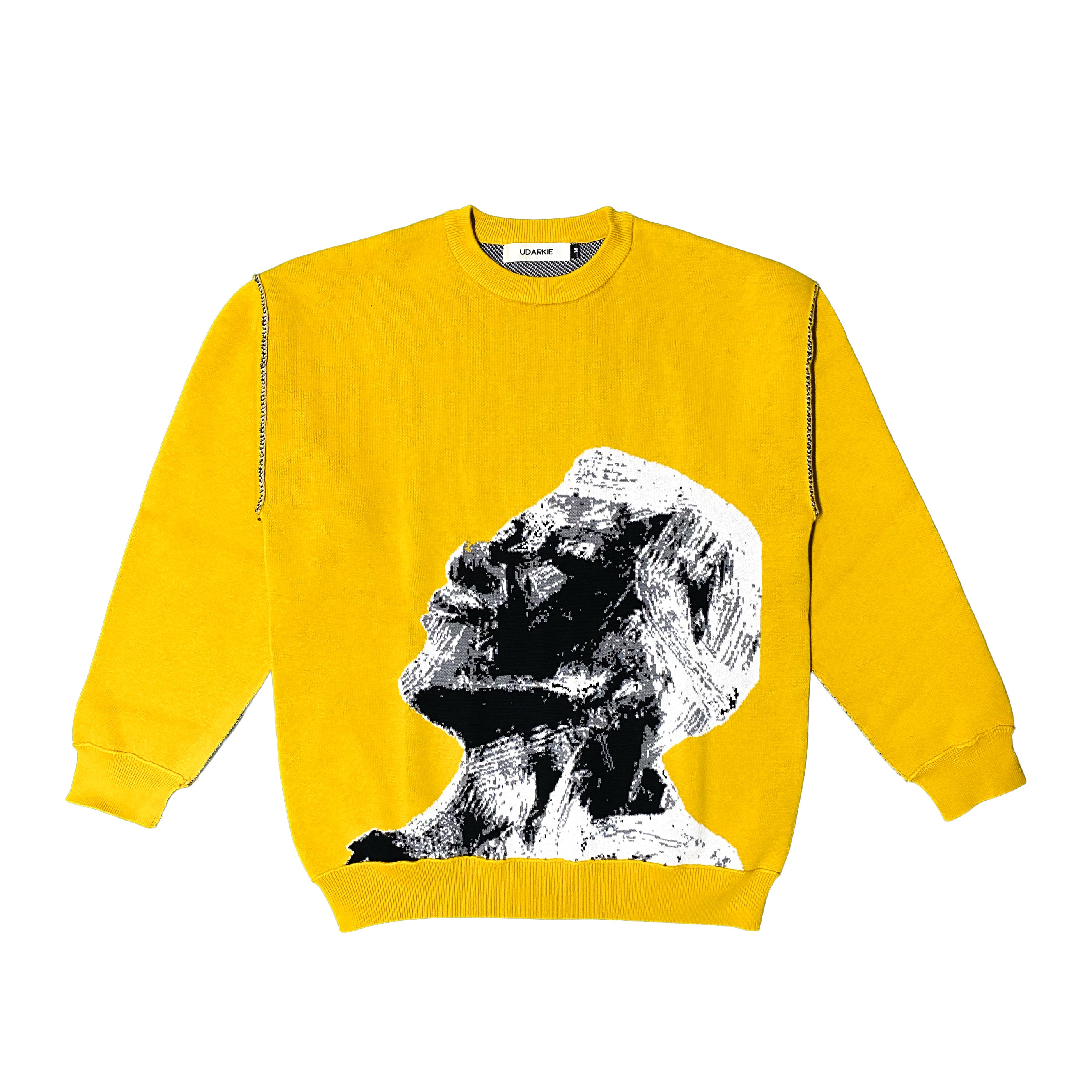 Yellow sweatshirt featuring black & white graphic print of an elderly person's side profile looking upwards. High-contrast design with artistic detail.