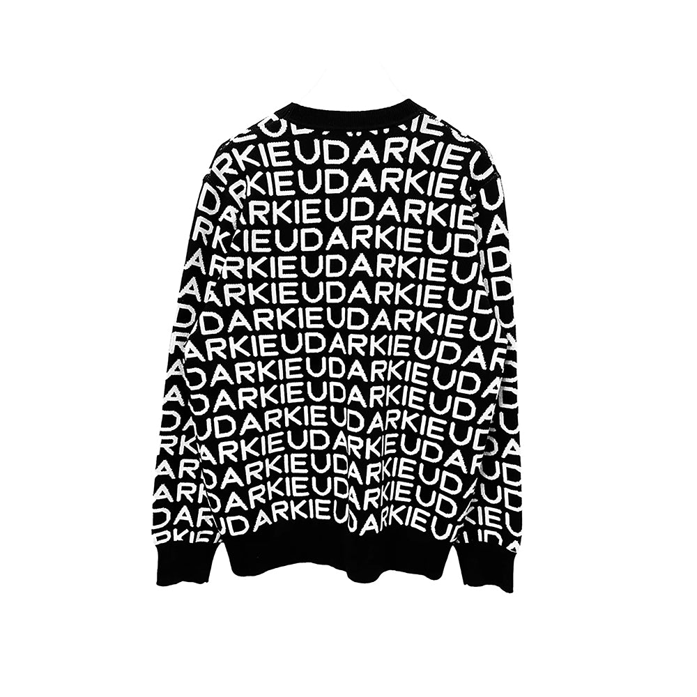 Black sweater with long sleeves and ribbed cuffs, hem, and neckline, featuring a repetitive white text pattern reading "UDARKIE" across the entire garment.