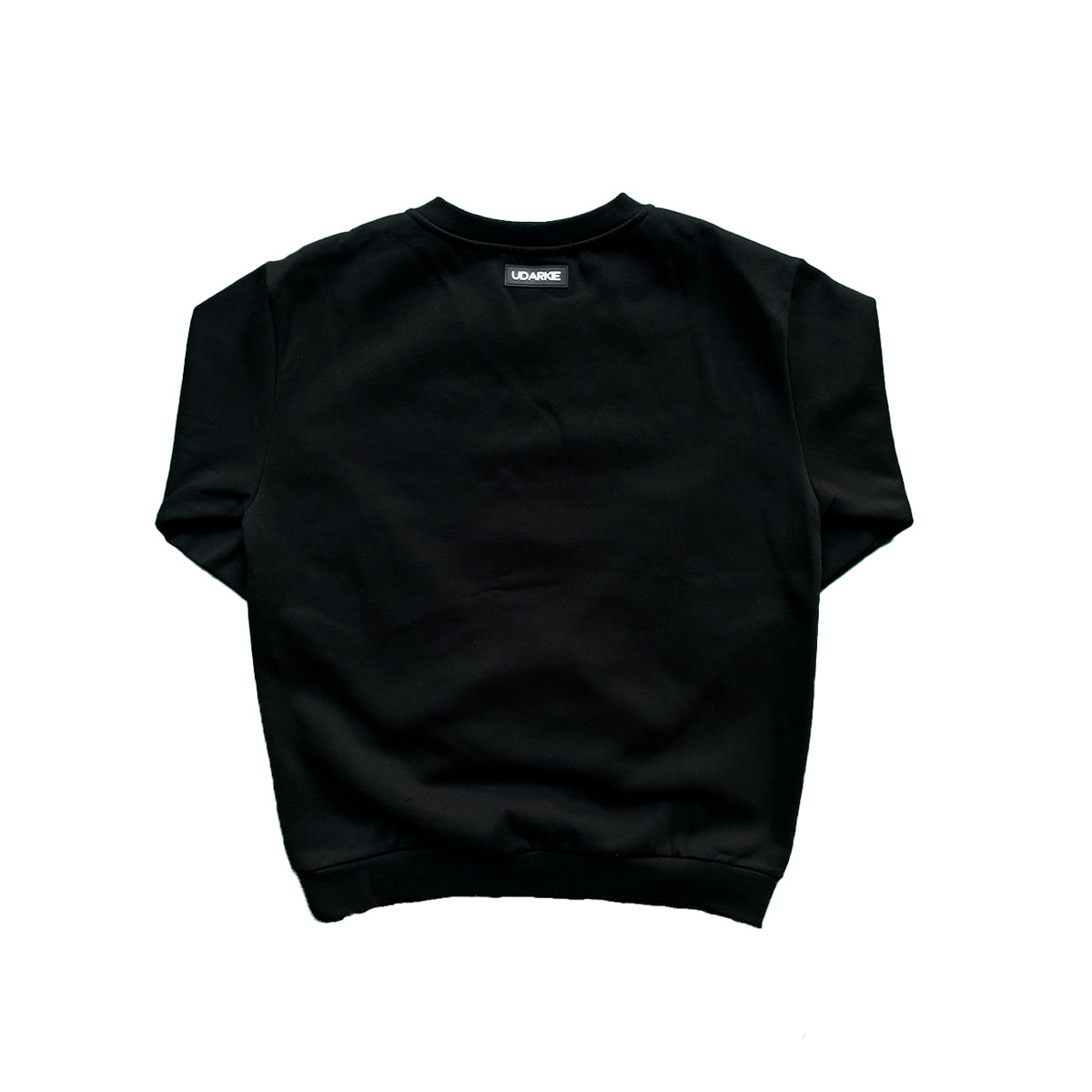Back view of black sweatshirt with long sleeves and a small "UDARKIE" label near the neckline.