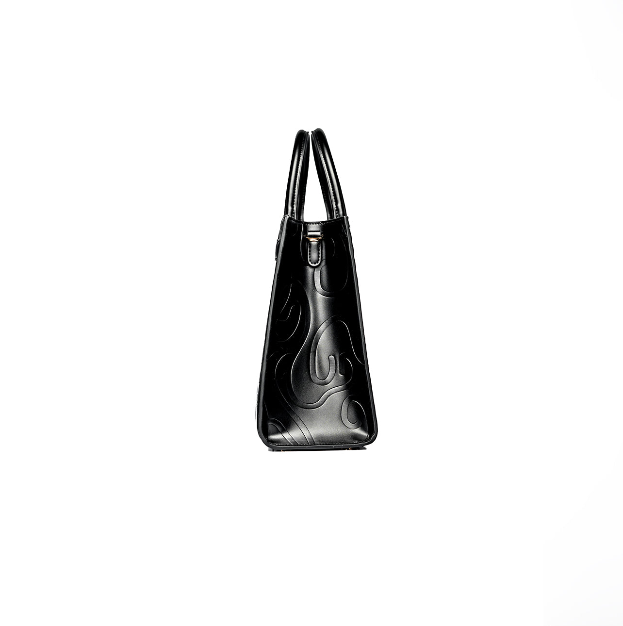 Black tote bag with two handles and embossed swirling patterns on a sleek surface, made of leather or similar material. Stylish and sophisticated fashion accessory.