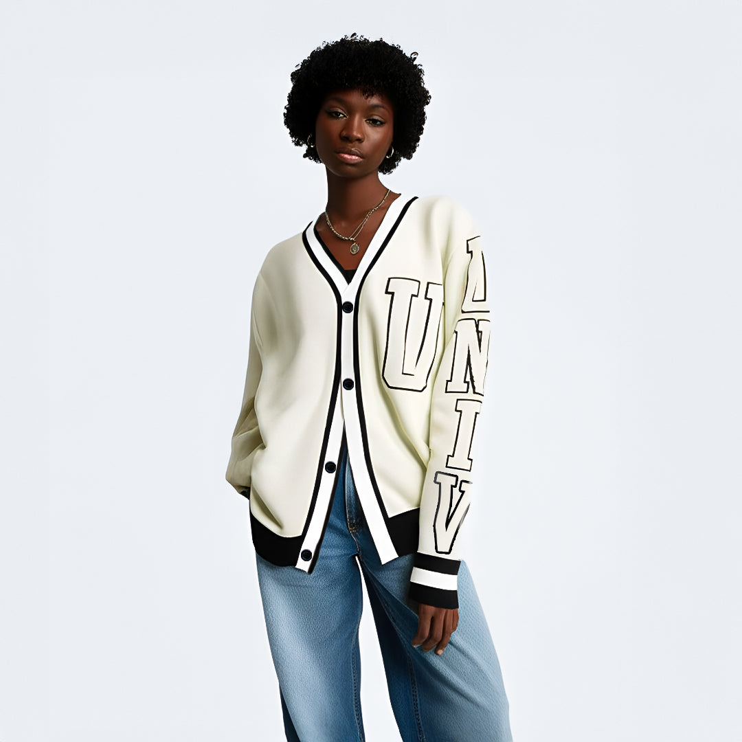 Cream white varsity-style cardigan with black trim and buttons, with "UNIV" text printed vertically on the left sleeve.