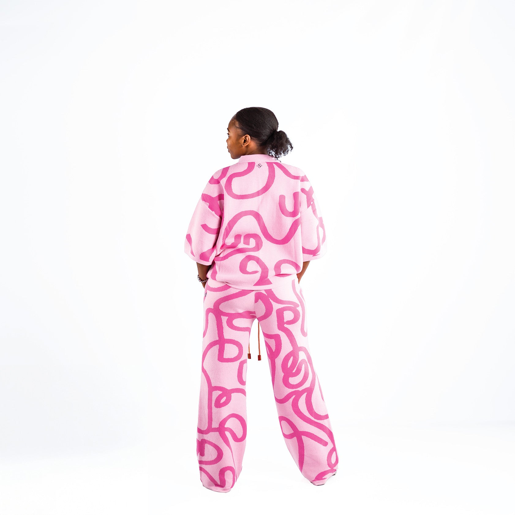 Women's knitted cotton pink two-piece outfit with white swirl print
