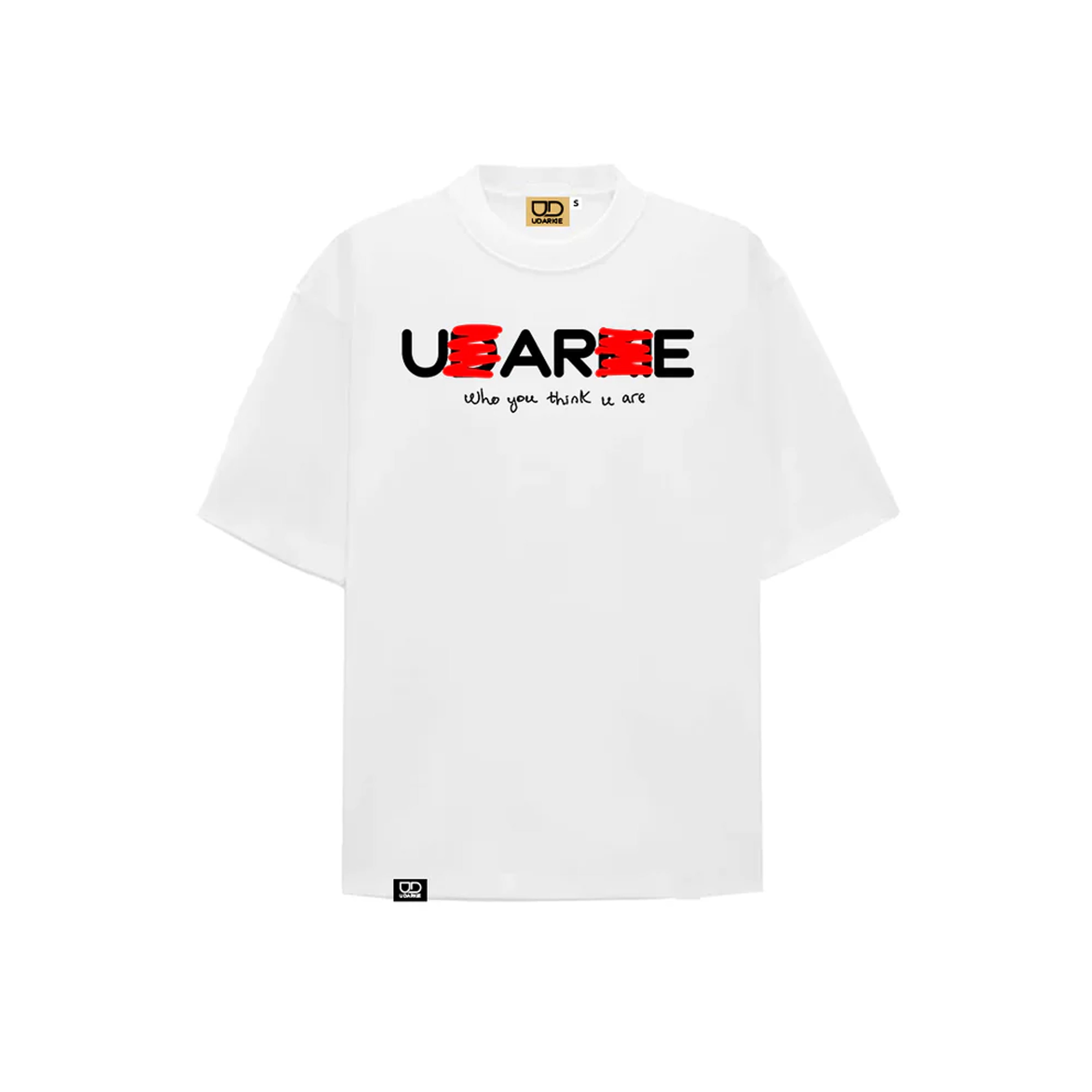 White T-shirt with "U ARE" text where "D" and "K" are crossed out in red to read "U ARE", and smaller text below saying "Who you think u are". Features UD LABEL branding at the neck and a small black tag at the bottom.