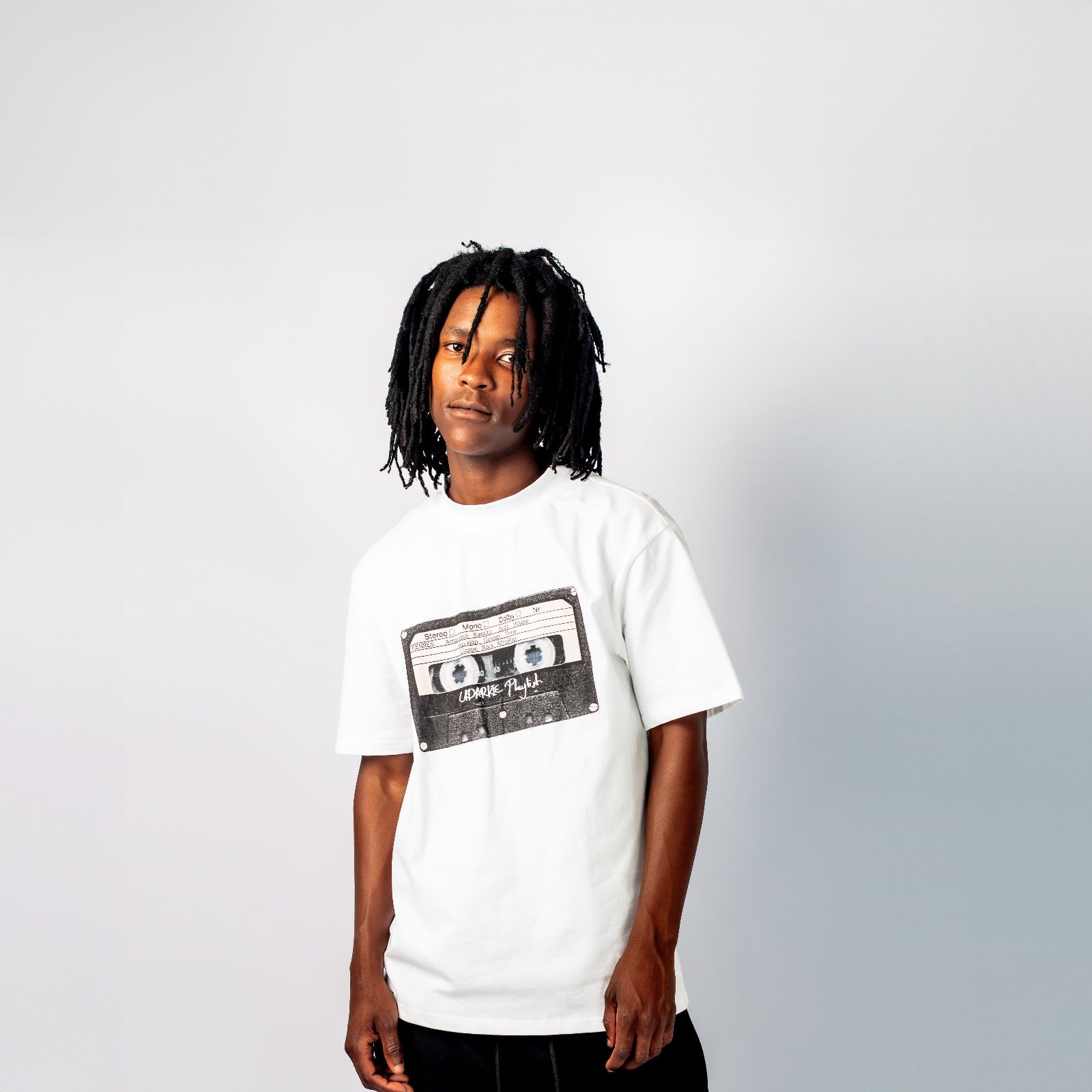 White T-shirt with a front graphic of a vintage cassette tape.