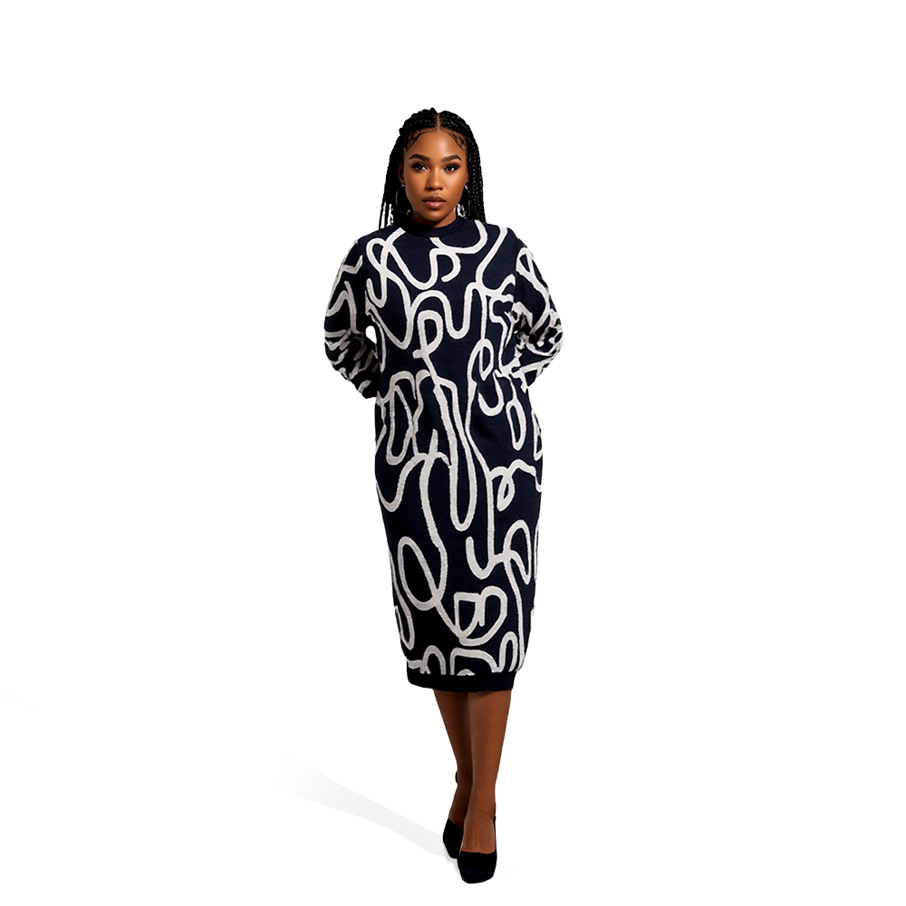 Person wearing a long-sleeved, knee-length Udiscover black dress with white abstract squiggle patterns and a high neckline, standing against a plain white background. The outfit is paired with black shoes.