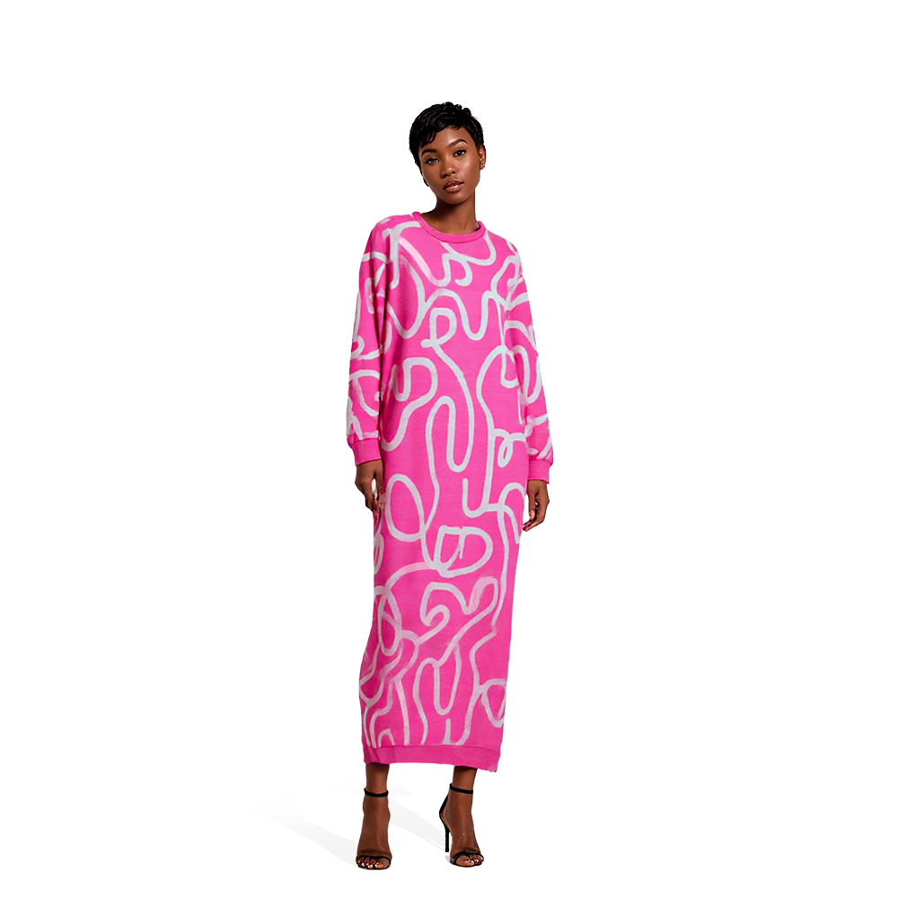 Person wearing a udiscover long pink dress with white swirl patterns, long sleeves, and ankle-length hem, standing against a plain white background.